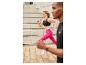 Femme courant en vêtements de sport Crivit : leggings et soutien-gorge.