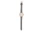 Une montre en cuir gris avec un cadran en or rose.