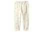 Pantalon de jogging pour enfant couleur crème avec un motif floral délicat.