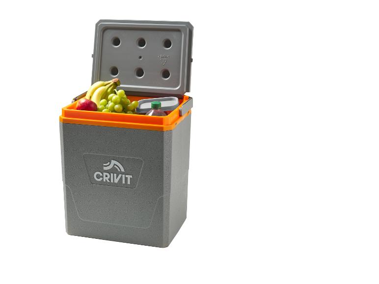 Glacière grise et orange remplie de fruits et de boissons, avec le couvercle ouvert.