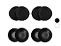 Quatre assiettes noires superposées sur fond blanc.