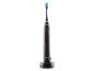Une brosse à dents électrique noire Nevadent sur sa base de charge.