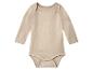 Body bébé beige à manches longues.