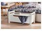 Un banc de rangement blanc avec un couvercle, un tiroir et une couverture bleue.