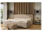 Une chambre moderne avec un lit et un matelas beiges.