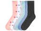 Lot de 7 paires de chaussettes côtelées de couleurs assorties, certaines à fleurs, et une noire.