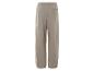 Pantalon beige avec élastique à la taille.