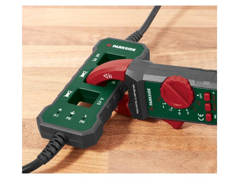 Un multimètre à pince numérique Parkside avec un bouton rotatif rouge et un boîtier vert.