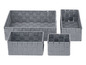 Quatre paniers de rangement gris en matériau tissé.
