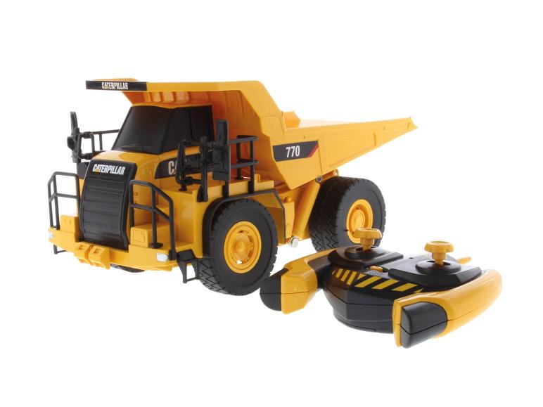 Camion benne Caterpillar 770 jaune et télécommande.