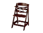 Une chaise haute Tripp Trapp marron foncé.