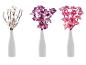 Trois vases blancs avec des fleurs lumineuses : blanches, violettes et roses.
