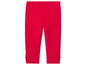 Leggings rouges avec des nœuds en bas.