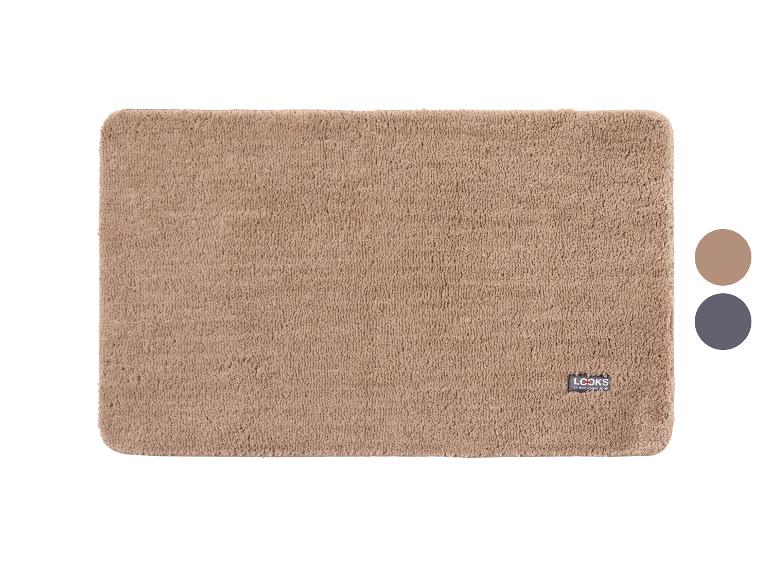 Tapis de bain beige avec logo et deux échantillons de couleur sur le côté droit.