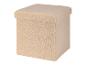 Une boîte de rangement en fourrure beige.