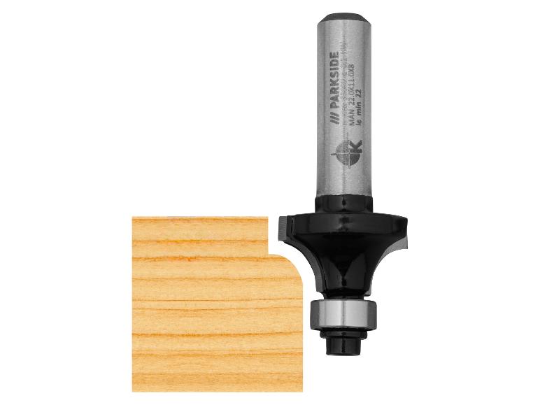 Fraise de défonceuse avec roulement, créant un bord arrondi sur une pièce de bois.