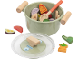 Marmite de jeu avec légumes et cuillère en bois