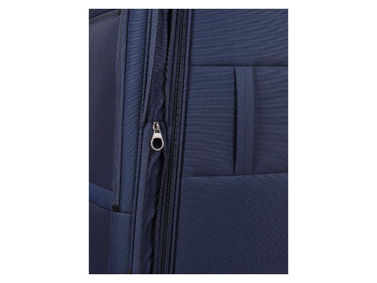 Gros plan d'une valise bleue avec une fermeture éclair et un curseur.