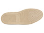 La semelle d'une basket beige avec un motif en losanges.