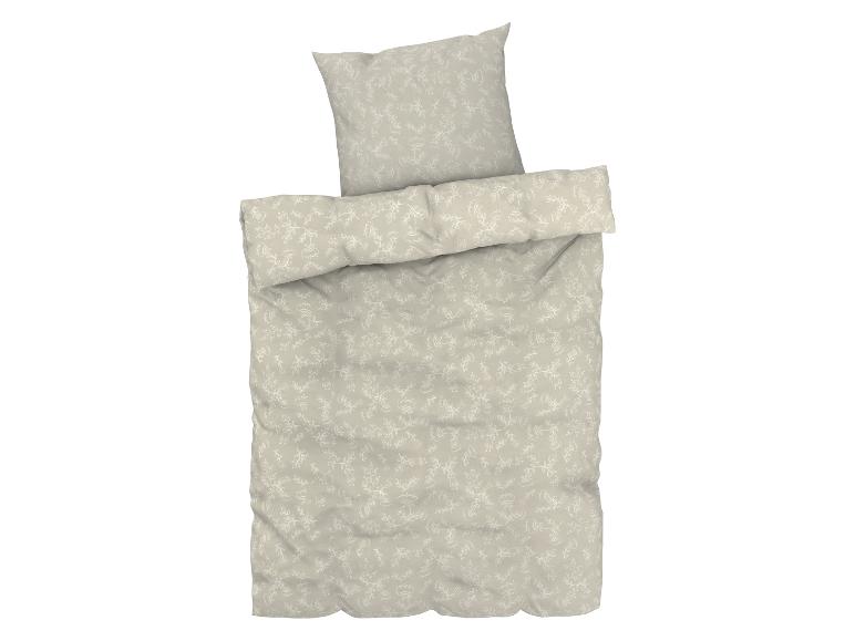 Housse de couette beige avec un motif floral blanc.