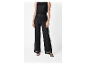 Pantalon large noir en maille avec top assorti.