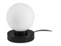 Une lampe de table noire avec un abat-jour rond blanc.