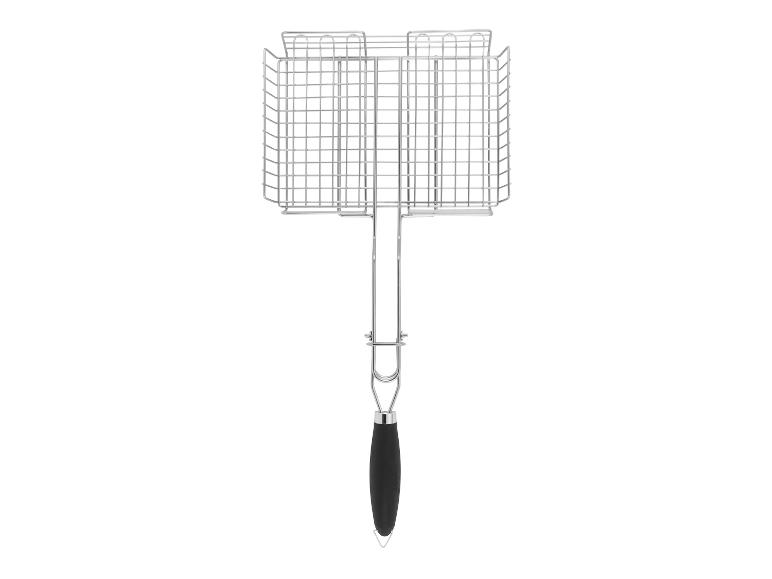 Une grille de barbecue avec une poignée noire.