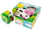 Puzzle en bois avec des images d'une vache, d'un mouton, d'une grenouille et d'un cerf.