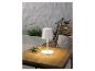 Lampe de table moderne blanche sur une table en bois.