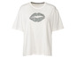 T-shirt blanc avec un motif de lèvres en imprimé zèbre.