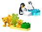 Ensemble LEGO DUPLO avec figurines de pingouins et lionceaux, et blocs de construction.