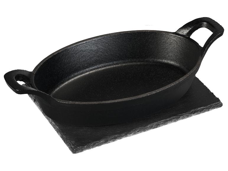 Poêle de service ovale en fonte sur une base en pierre