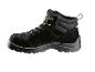 Botte de travail haute en cuir noir.