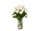 Bouquet de roses blanches fraîches dans un vase en verre.
