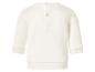 Sweat-shirt blanc à manches longues pour enfant avec fermeture à boutons-pression au dos.