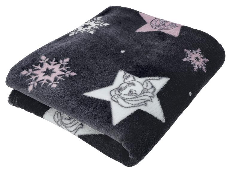 Couverture noire avec des flocons de neige roses et des étoiles de personnages de dessins animés.