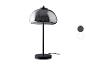 Lampe de table noire avec abat-jour en verre gris.