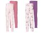Deux paires de leggings pour enfants: un rose clair avec des ballerines et un rose uni, et un rose clair avec des licornes et un violet uni.
