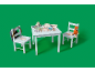 Table et chaises pour enfants avec thème forêt, sac à dos et peluche.