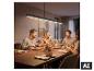 Suspension moderne BRILONER au-dessus d'une table à manger en famille. [image générée par l'IA]