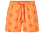 Short de bain orange avec un motif de crabes rouges.