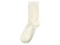 Une chaussette blanche en coton.