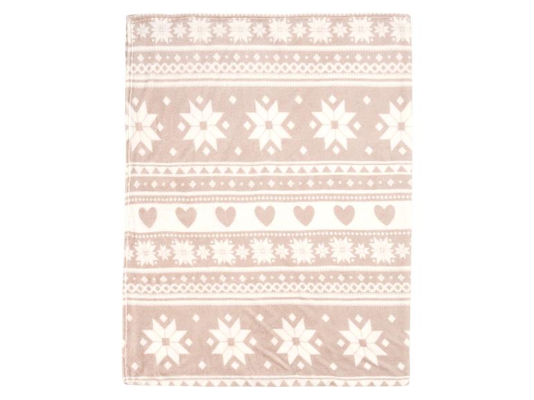 Couverture douce beige avec motif de flocons de neige et cœurs.