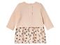 Une robe Winnie l'ourson rose à manches longues.