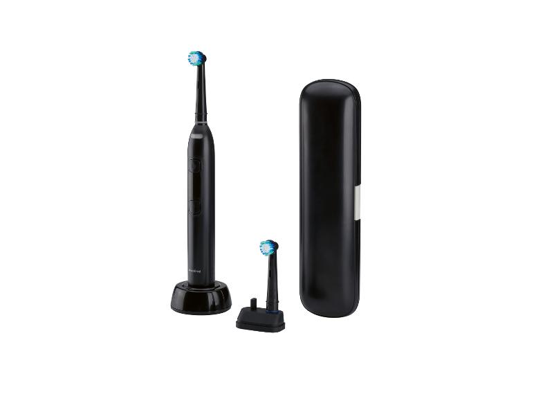 Une brosse à dents électrique Nevodent, une tête de rechange et un étui de voyage.