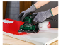 Une personne utilise une ponceuse Parkside pour poncer une surface peinte.