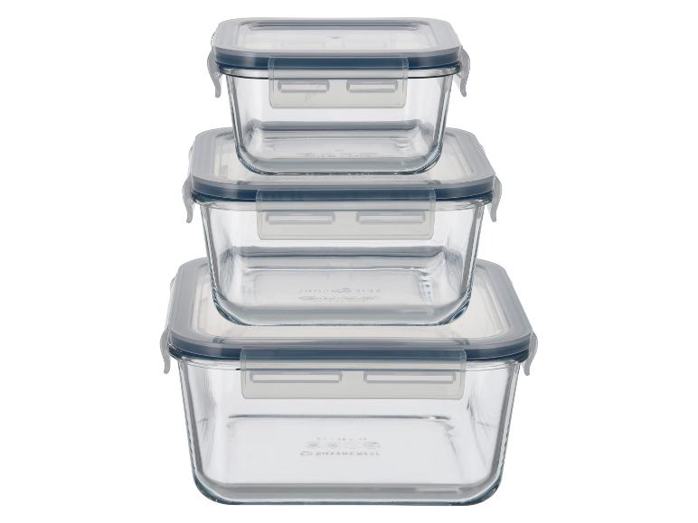 Trois récipients de conservation en verre avec couvercles gris, empilés verticalement