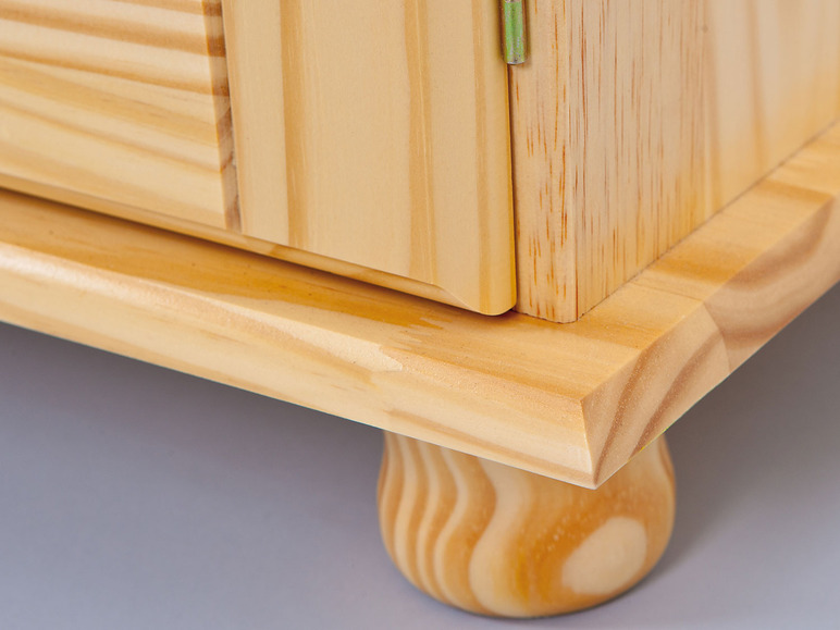 Fond d'une armoire en bois avec des pieds.