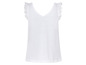 Top blanc sans manches avec dentelle sur les épaules.