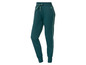 Pantalon de survêtement vert foncé avec des bandes blanches sur les côtés.